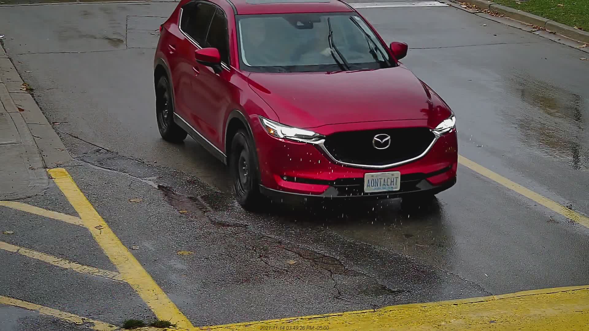 Red Mazda CX-5 at entrance